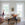 Living room with white sofa, coffee table, and decorative items.