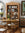 Dining room with wooden bookshelf, table, and chairs.