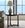 Round side table with a lamp in a living room setting