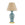 Table lamp with a blue speckled base and beige lampshade on a white background