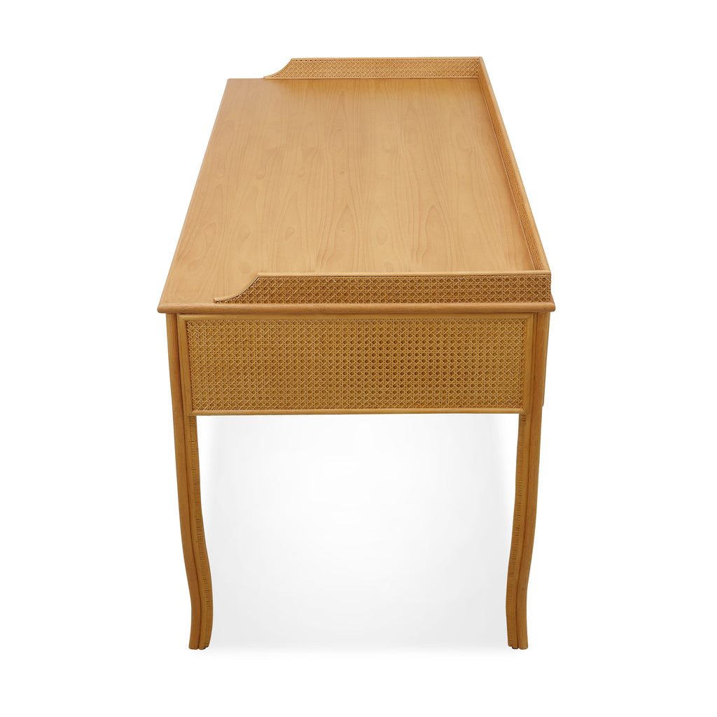 heron paneled cane desk with three drawers
