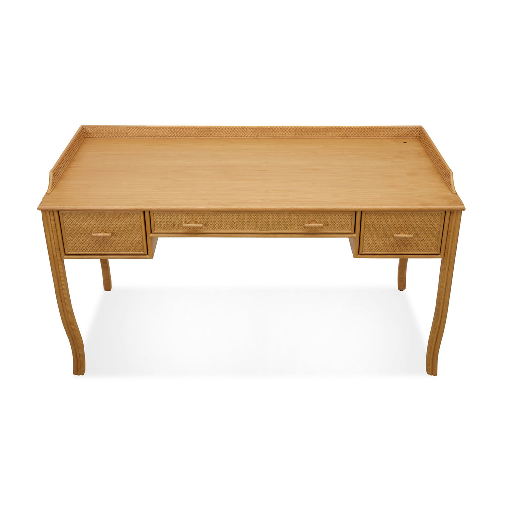 heron paneled cane desk with three drawers