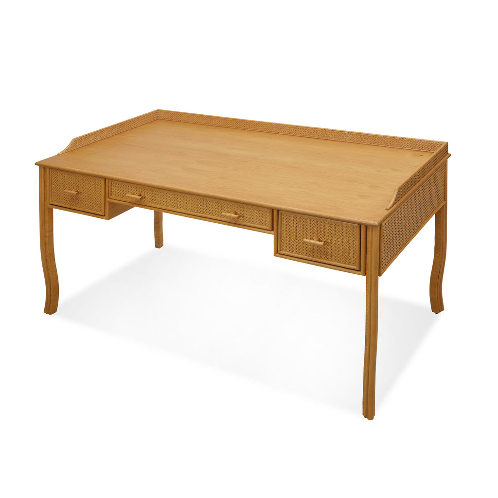 heron paneled cane desk with three drawers