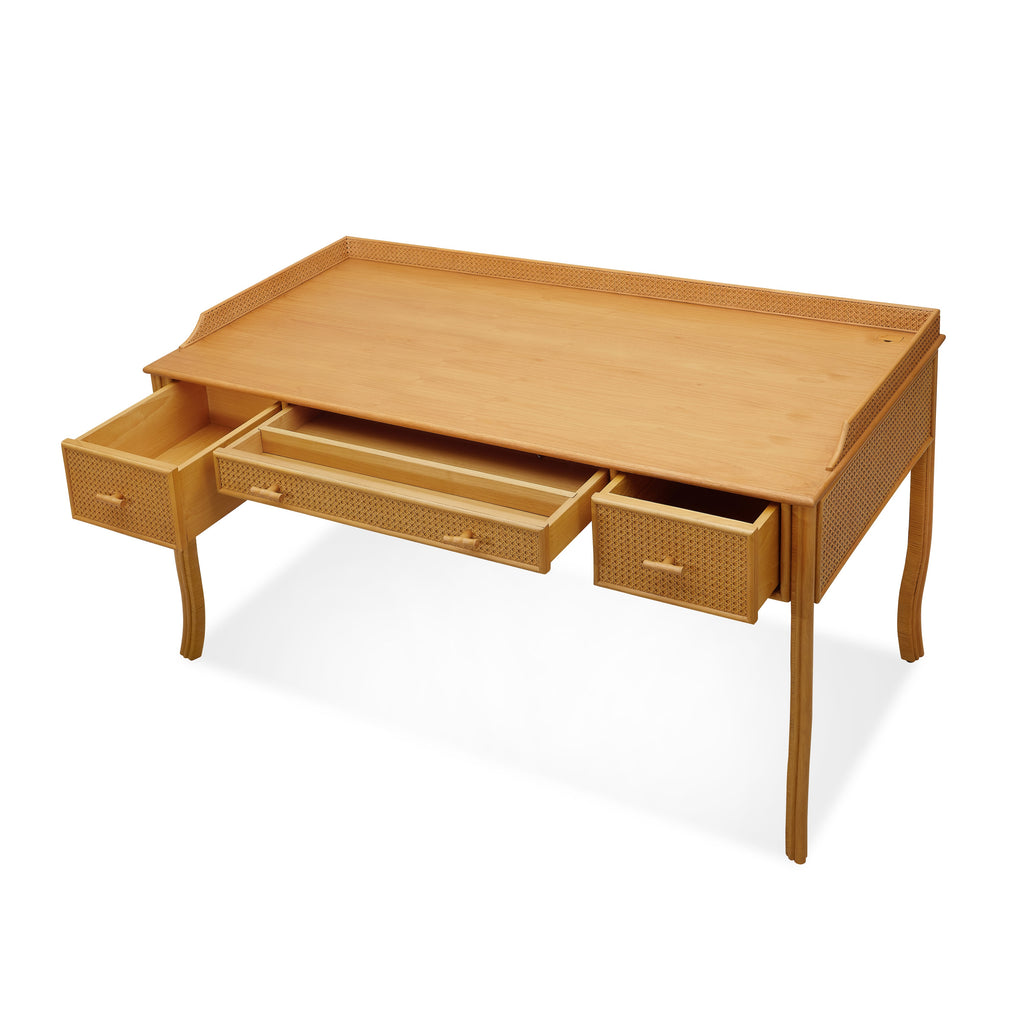 heron paneled cane desk with three drawers