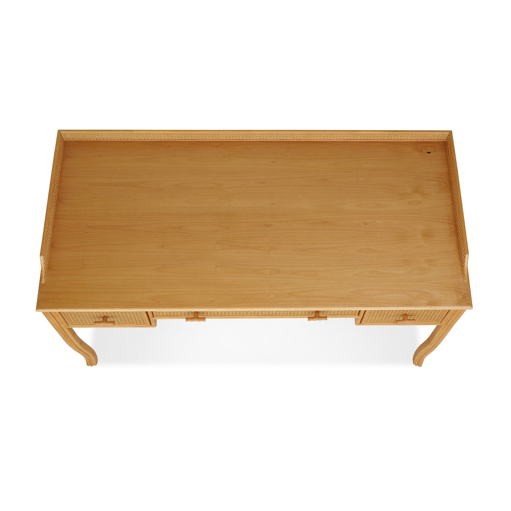 heron paneled cane desk with three drawers