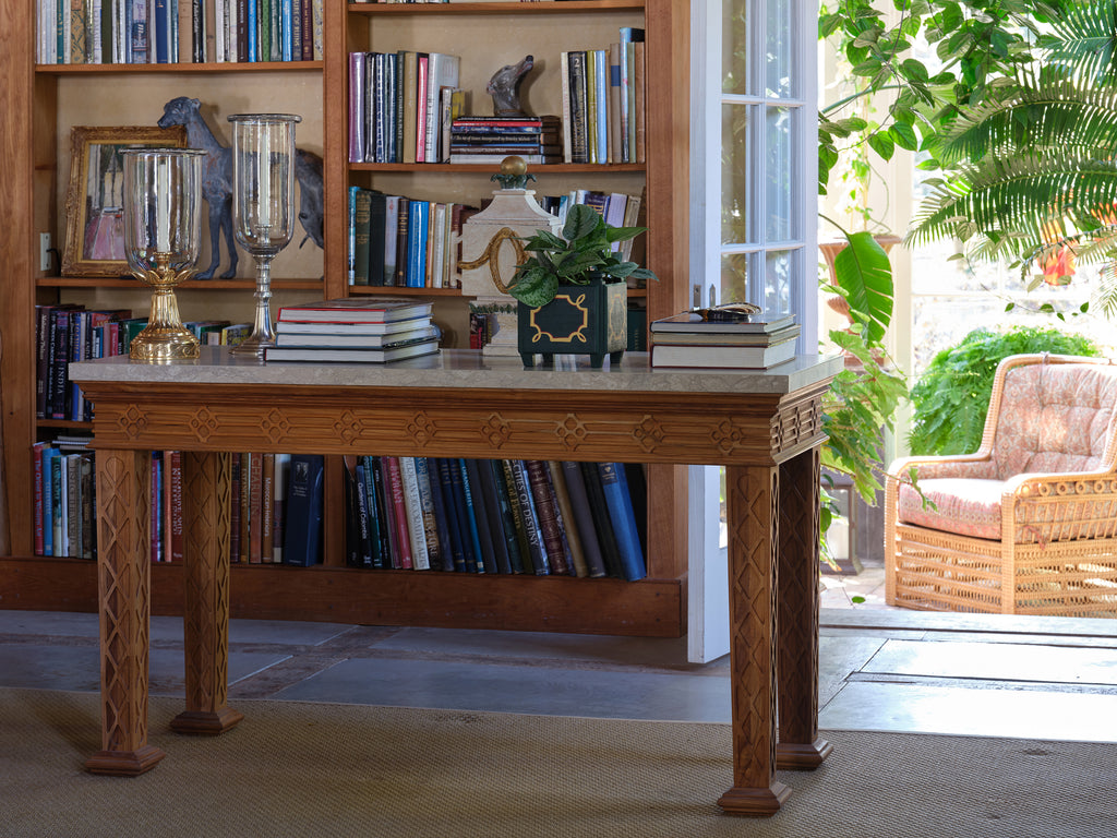 howard outdoor console table with a light-marble top with carved legs by bunny williams home