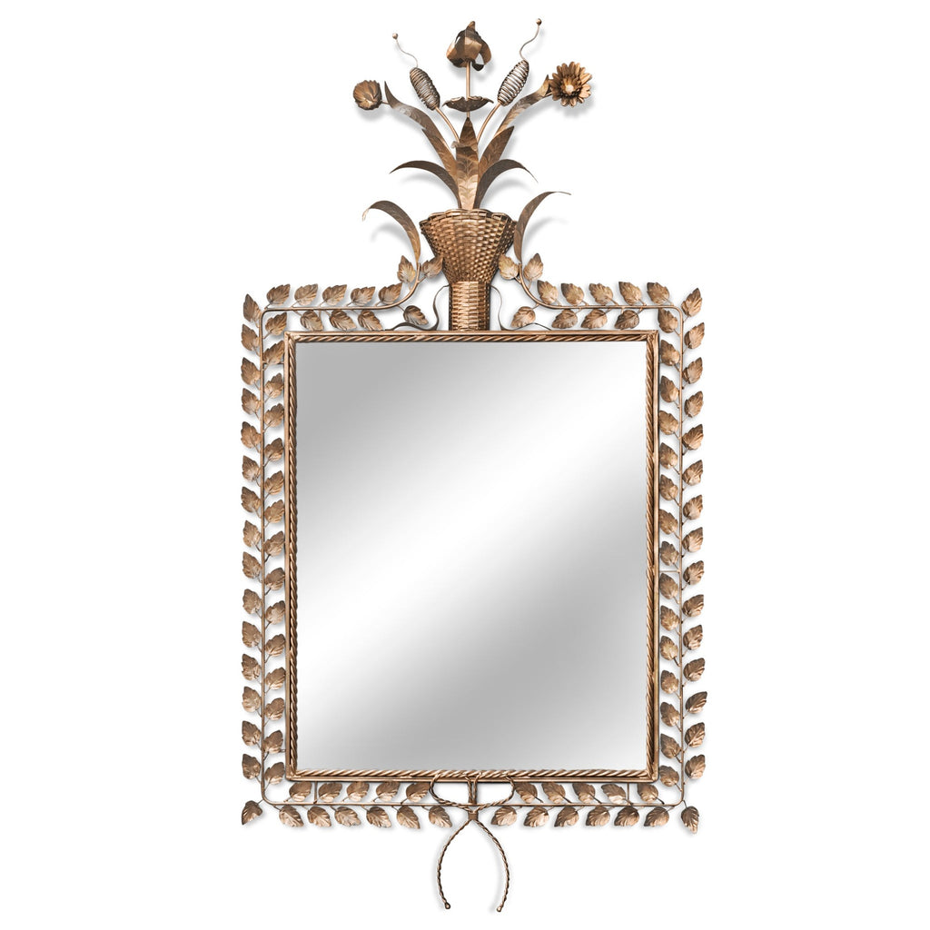 jardin mirror is framed with gilded leaves that meet at the top to gilded pods and flowers