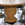 Wicker table with a checkered floor and chairs around it