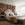 Neatly arranged bedroom with a bed, nightstands, and decor.