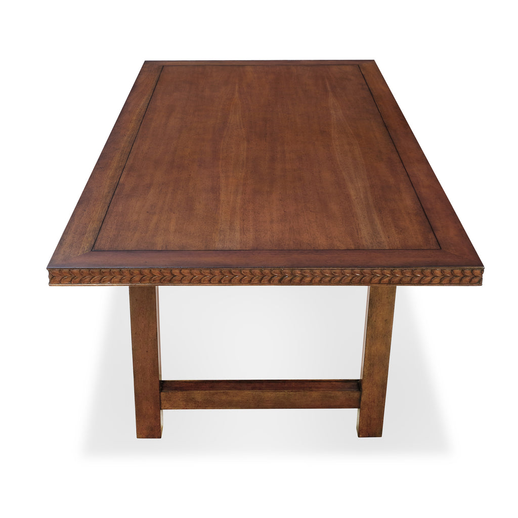 holland dining table with hand-carved floral motif runs along the table top side and down the legs by bunny williams home