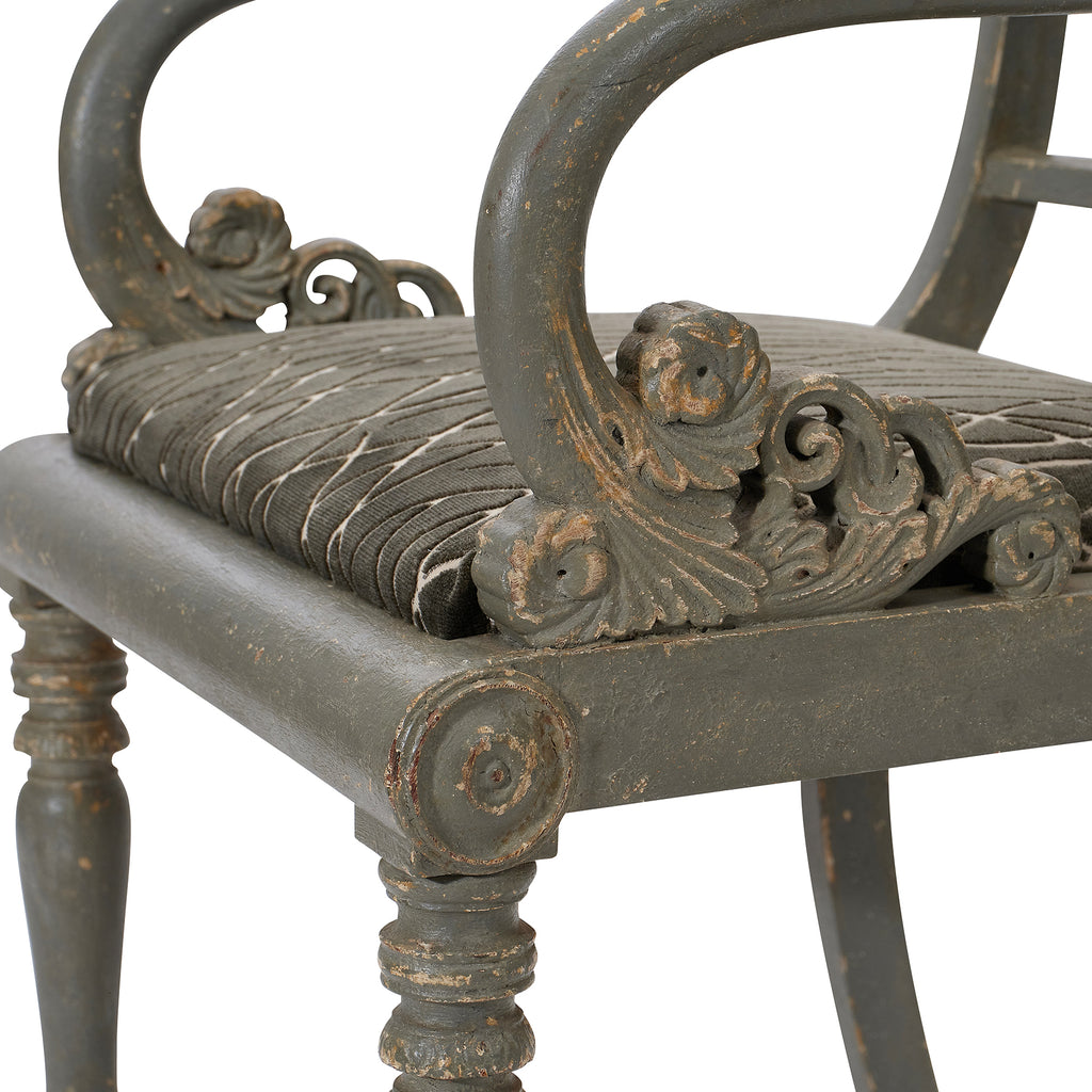 19th century grey-green painted armchairs - close up of carving on arm