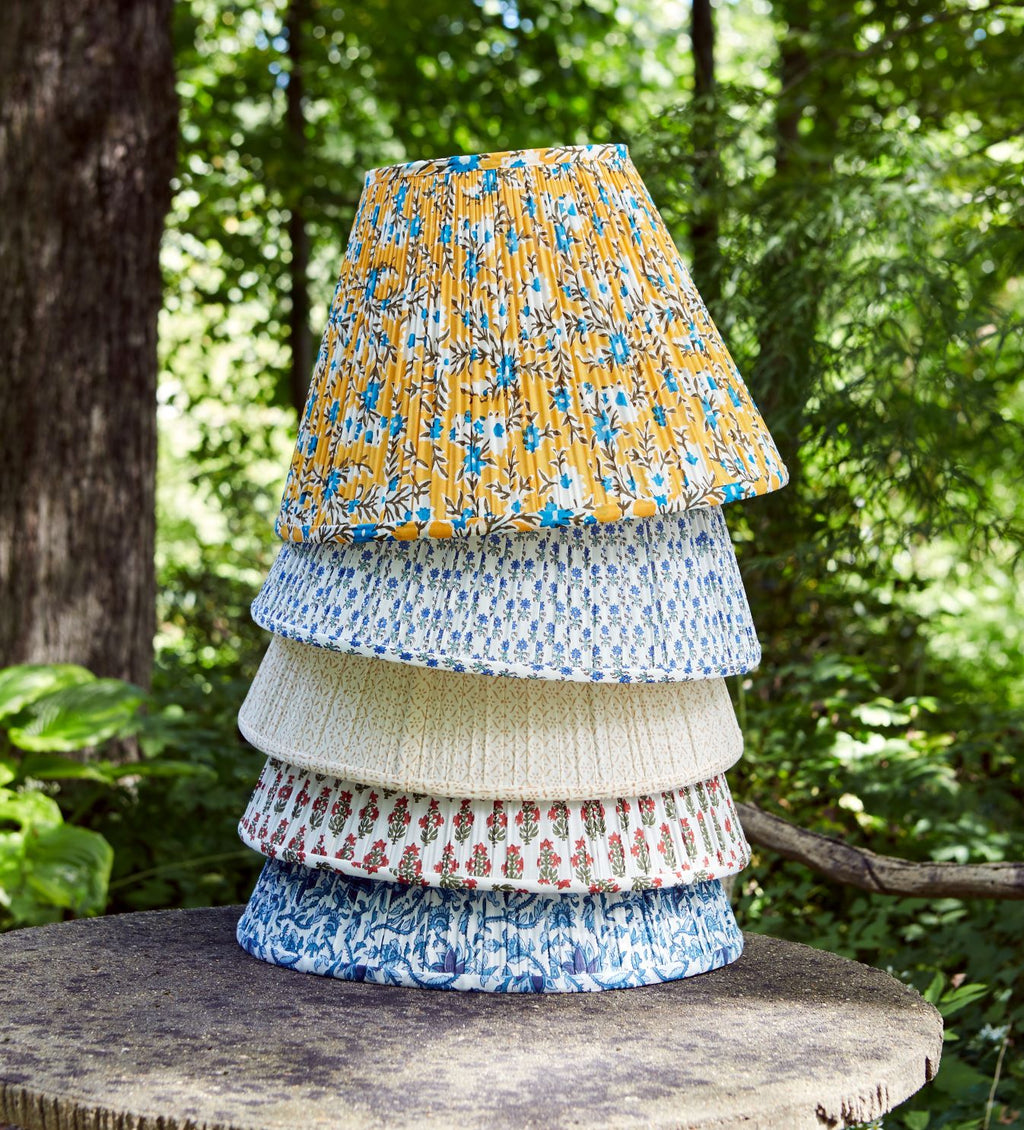 a stack of block printed lampshades